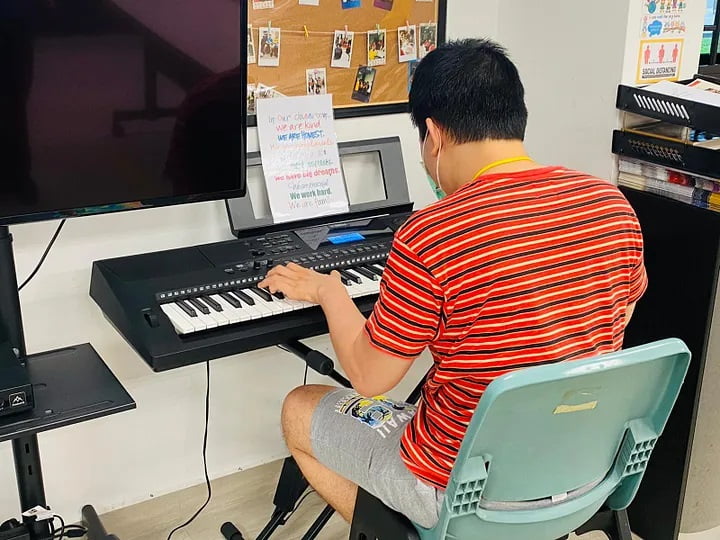 Christopher on the piano